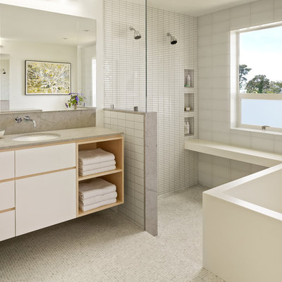 Inspiration for a contemporary master white tile mosaic tile floor bathroom remodel in San Francisco with an undermount sink, flat-panel cabinets, white cabinets, white walls and gray countertops