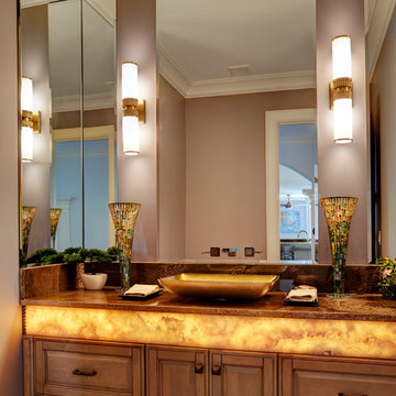 Back Lit Onyx Counter Top in Master Bath in Gold Vessel Sink