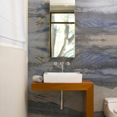 Bathroom - contemporary blue tile and stone slab bathroom idea in DC Metro with wood countertops and brown countertops