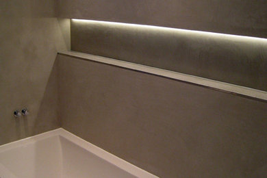 Photo of an expansive contemporary bathroom in London with grey walls.