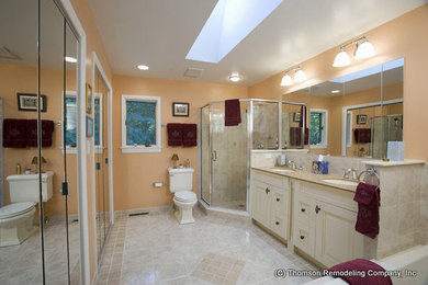Design ideas for a large traditional ensuite bathroom in Baltimore with a built-in bath, an alcove shower, a two-piece toilet, beige tiles, ceramic tiles, beige walls, ceramic flooring and a submerged sink.