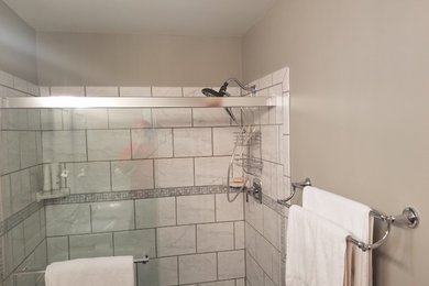 Example of a large minimalist master brown tile and cement tile cement tile floor and gray floor bathroom design in Philadelphia with raised-panel cabinets, gray cabinets, a two-piece toilet, brown walls, an undermount sink and quartzite countertops