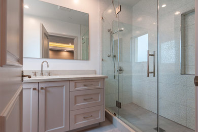 Inspiration for a small transitional kids' multicolored tile and porcelain tile porcelain tile and gray floor doorless shower remodel in Los Angeles with shaker cabinets, gray cabinets, a one-piece toilet, white walls, an undermount sink, quartz countertops, a hinged shower door and white countertops