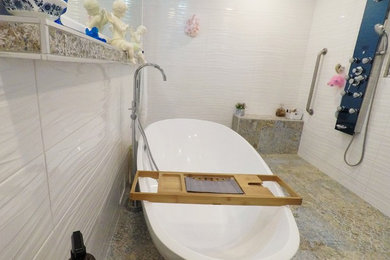 Bathroom - large modern master white tile and ceramic tile porcelain tile and multicolored floor bathroom idea in Other with shaker cabinets, beige cabinets, a one-piece toilet, white walls, an undermount sink, beige countertops and granite countertops