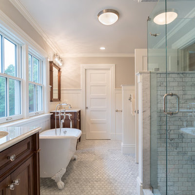 Inspiration for a farmhouse gray tile gray floor bathroom remodel in Providence with an undermount sink, recessed-panel cabinets, dark wood cabinets and a hinged shower door