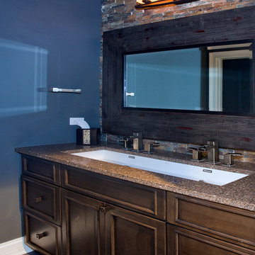 Basement Bath with Stained Concrete Floor, Knotty Alder Recessed Panel Cabinetry