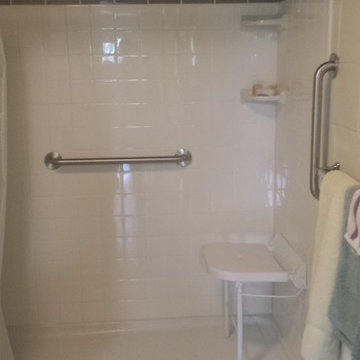 Basement Shower with tile walls and seat