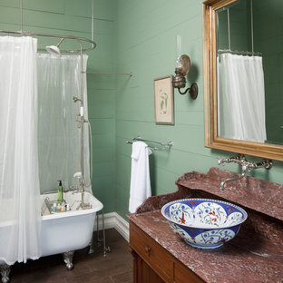 Inspiration for a farmhouse bathroom remodel in Austin with a vessel sink and green walls
