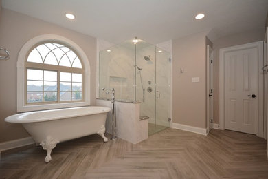 Inspiration for a large timeless master white tile and porcelain tile porcelain tile and gray floor bathroom remodel in Other with gray cabinets, a two-piece toilet, gray walls, an undermount sink, quartz countertops, a hinged shower door, beaded inset cabinets and white countertops