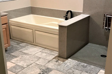Example of a minimalist master cement tile floor, gray floor and double-sink bathroom design in Denver with light wood cabinets, beige walls, a vessel sink, onyx countertops and a built-in vanity