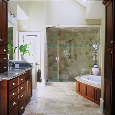 Inspiration for a contemporary beige tile bathroom remodel in Atlanta with an undermount sink, flat-panel cabinets and dark wood cabinets