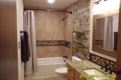 Example of a mid-sized arts and crafts bathroom design in Other