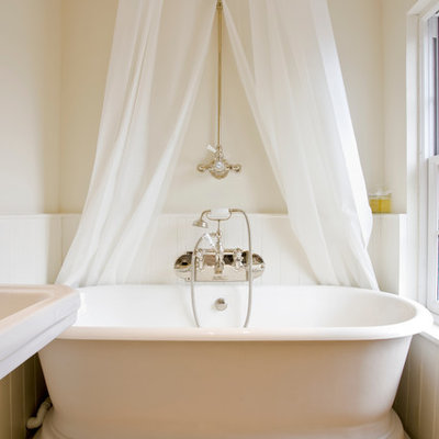 Freestanding bathtub - victorian freestanding bathtub idea in Surrey with beige walls