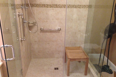 Example of a tuscan beige tile and ceramic tile ceramic tile corner shower design in DC Metro with beige walls
