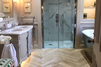 Medium sized romantic ensuite bathroom in Other with a freestanding bath, a walk-in shower, a one-piece toilet, white tiles, marble tiles, marble worktops, a hinged door and white worktops.