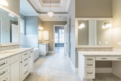 Example of a bathroom design in Raleigh with marble countertops