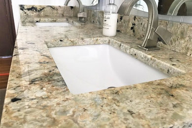Inspiration for a large farmhouse bathroom remodel in Other with an undermount sink and granite countertops