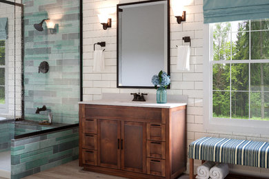 Large rustic ensuite bathroom in Milwaukee with shaker cabinets, medium wood cabinets, a walk-in shower, white tiles, metro tiles, blue walls, cement flooring, an integrated sink, engineered stone worktops, grey floors and a hinged door.