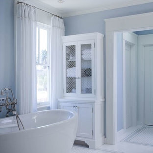Inspiration for a large traditional master bathroom in San Diego with shaker cabinets, white cabinets, a freestanding tub, blue walls, linoleum floors, an undermount sink, a shower/bathtub combo, white floor and an open shower.