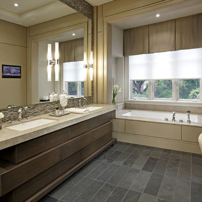 Bathroom - large contemporary master beige tile slate floor bathroom idea in Toronto with an undermount sink, an undermount tub, dark wood cabinets, beige walls and granite countertops