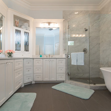 Bathroom | Elegant Custom Cabinets | Marble Tile & Freestanding Tub