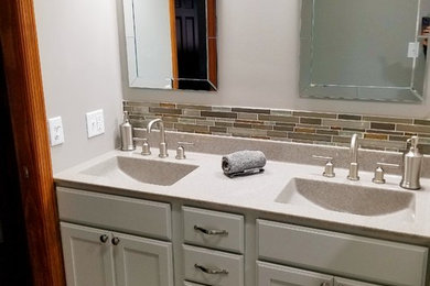 Mid-sized elegant master beige tile, brown tile and matchstick tile porcelain tile and brown floor bathroom photo in Chicago with recessed-panel cabinets, white cabinets, white walls, an integrated sink and quartzite countertops