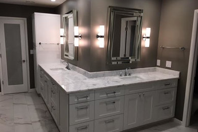 Large transitional master gray tile, white tile and stone tile marble floor and white floor bathroom photo in Denver with brown walls, an undermount sink, shaker cabinets, gray cabinets and quartzite countertops