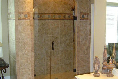 Corner shower - beige tile corner shower idea in Kansas City with a drop-in sink and beige walls