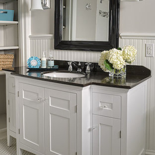 Inspiration for a small timeless white tile and subway tile mosaic tile floor bathroom remodel in St Louis with an undermount sink, furniture-like cabinets, white cabinets, granite countertops, a two-piece toilet and beige walls