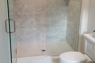 Marble tile bathroom photo in New York