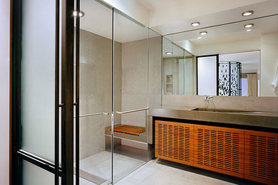 Inspiration for a large master corner shower remodel in New York with beige walls