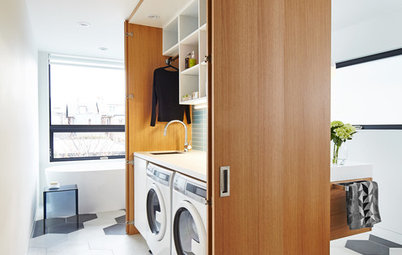A Clever Storage Box Hides a Laundry Room Inside a Bath