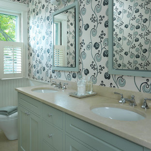 Example of a classic bathroom design in Boston with an undermount sink, recessed-panel cabinets, blue cabinets, multicolored walls and quartzite countertops