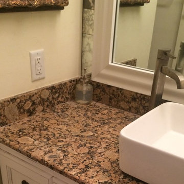 Bathroom redo with framed mirror and antique mirror tiles