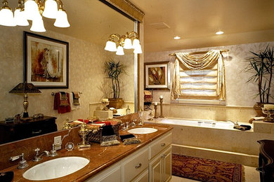 Example of a small transitional master beige tile and ceramic tile bathroom design in San Francisco with raised-panel cabinets, white cabinets and marble countertops