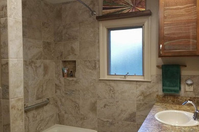 Photo of a medium sized rustic shower room bathroom with recessed-panel cabinets, brown cabinets, an alcove bath, an alcove shower, beige tiles, porcelain tiles, beige walls, porcelain flooring, a built-in sink, laminate worktops, beige floors and a shower curtain.