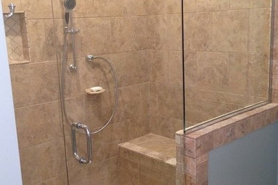 Corner shower - large traditional master beige tile and ceramic tile ceramic tile and beige floor corner shower idea in Birmingham with blue walls and a hinged shower door