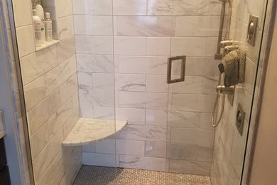 Alcove shower - mid-sized transitional master white tile and marble tile marble floor and white floor alcove shower idea in Philadelphia with recessed-panel cabinets, dark wood cabinets, a two-piece toilet, white walls, an undermount sink, marble countertops, a hinged shower door and white countertops