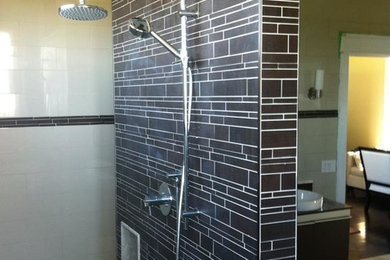 Mid-sized master brown tile and ceramic tile ceramic tile walk-in shower photo in Toronto with dark wood cabinets, beige walls and a vessel sink