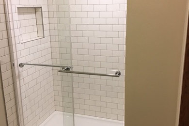 Inspiration for a mid-sized 3/4 white tile and ceramic tile ceramic tile bathroom remodel in Other