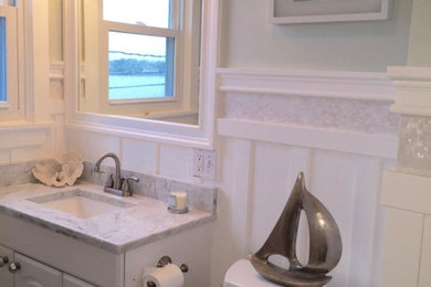Example of a beach style green tile and mosaic tile single-sink bathroom design in Boston with white cabinets, quartzite countertops, gray countertops and a built-in vanity