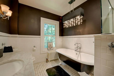 Large transitional master white tile and subway tile marble floor, white floor and single-sink bathroom photo in Cleveland with recessed-panel cabinets, white cabinets, a two-piece toilet, brown walls, an undermount sink, marble countertops, a hinged shower door, gray countertops and a built-in vanity