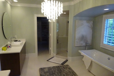 Example of a mid-sized transitional porcelain tile bathroom design in Dallas with flat-panel cabinets, dark wood cabinets, blue walls, a vessel sink and solid surface countertops
