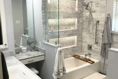 Bathroom - large contemporary master marble tile slate floor and gray floor bathroom idea in Houston with shaker cabinets, white cabinets, gray walls, an integrated sink and marble countertops