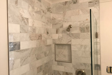 Mid-sized trendy 3/4 gray tile and marble tile bathroom photo in Tampa with white walls