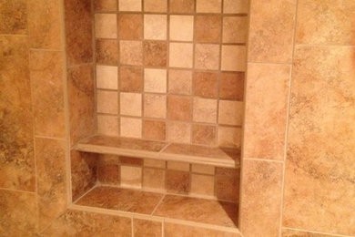 Corner shower - traditional corner shower idea in New York with an undermount sink, furniture-like cabinets, dark wood cabinets, granite countertops and a two-piece toilet