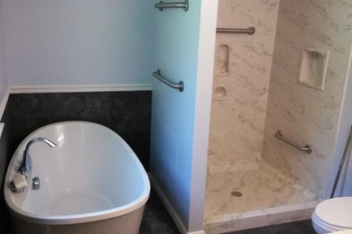 Mid-sized trendy master vinyl floor bathroom photo in Other with white cabinets, a two-piece toilet, an integrated sink, solid surface countertops and a hinged shower door