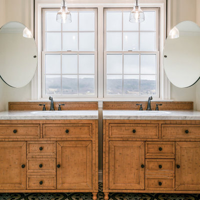 Example of a large transitional master multicolored floor and double-sink bathroom design in New York with furniture-like cabinets, medium tone wood cabinets, beige walls, an undermount sink, gray countertops and a freestanding vanity