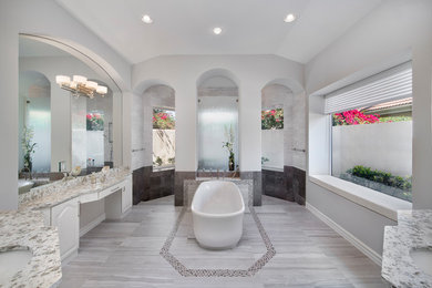 Transitional master gray tile and marble tile porcelain tile bathroom photo in Miami with raised-panel cabinets, white cabinets, gray walls, an undermount sink and quartz countertops