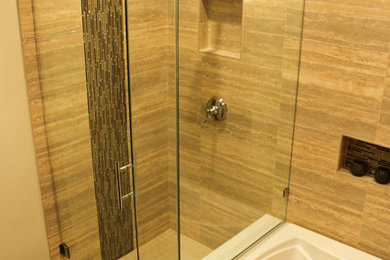 Cette image montre une petite salle de bain principale en bois brun avec un placard à porte plane, une baignoire posée, une douche d'angle, WC séparés, un carrelage multicolore, des carreaux de porcelaine, un mur beige, un sol en carrelage de porcelaine, un lavabo encastré et un plan de toilette en quartz.